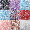 A collection of colorful acrylic bow beads in various shades including pink, purple, blue, and clear, used for DIY jewelry an