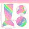 A glow-in-the-dark mermaid tail blanket for kids showing a pink and green iridescent design.