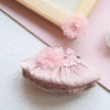 A pink satin mini doll wedding dress outfit set with ruffled details and a floral embellishment