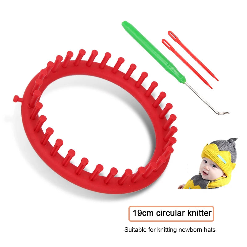 Red circular knitter tool with a green hook and knitting needles shown next to a baby