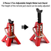 Two red metal jack stands with adjustable height and a vertical metal jack stand component.