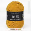 A ball of yellow milk cotton yarn labeled YIMIAN 56 Gold color for knitting and crochet