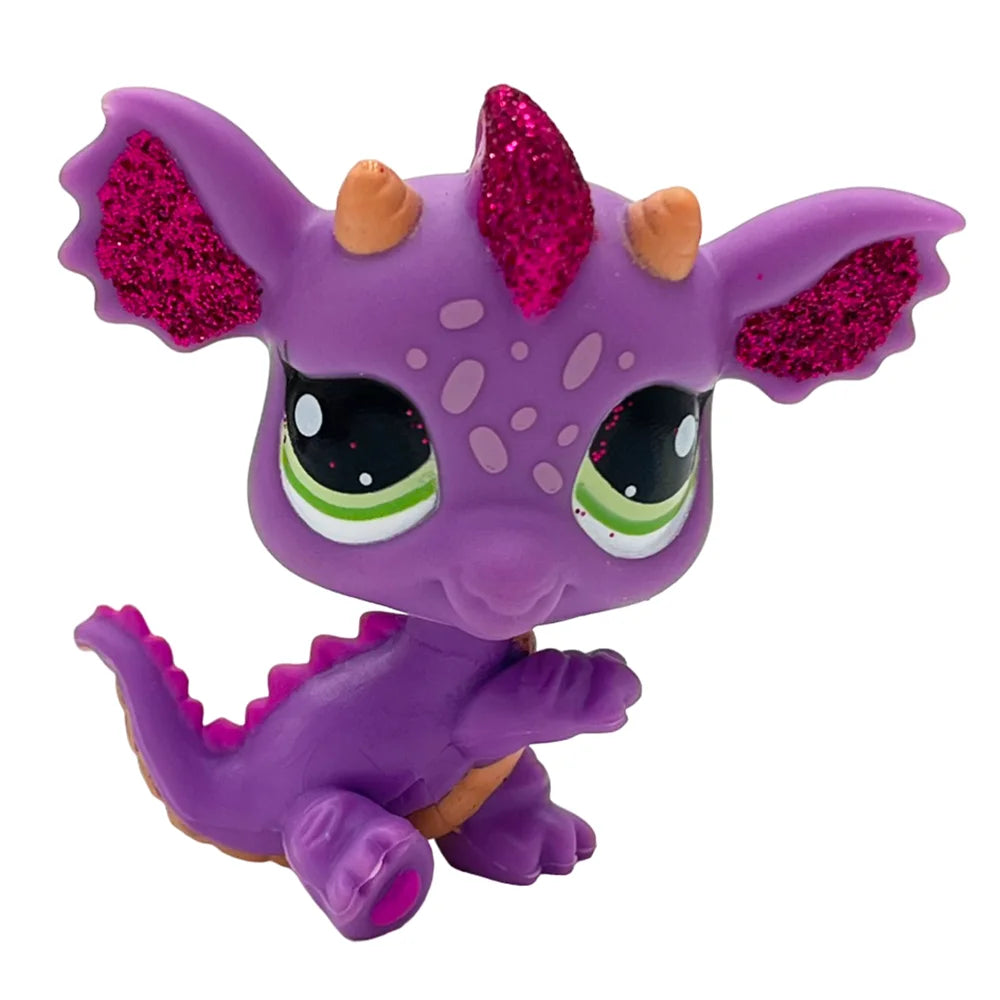 A purple charming bobble head pet figurine with pink glitter accents on its horns and ears.