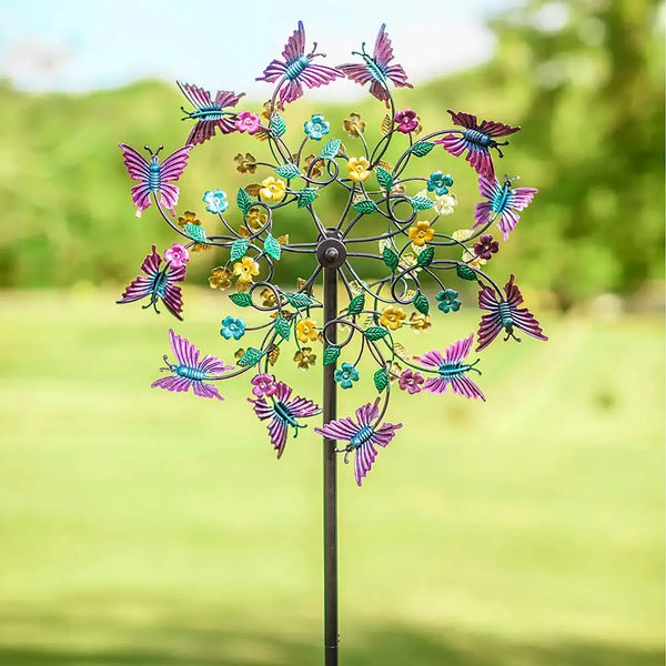 A metal butterfly wind garden decor featuring colorful butterflies and flowers on a dark pole.