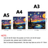 A set of wooden jigsaw puzzles labeled A3, A4, A5, and A3 with a night sky design.
