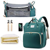 A teal backpack diaper bag featuring a built-in changing pad and storage pockets.