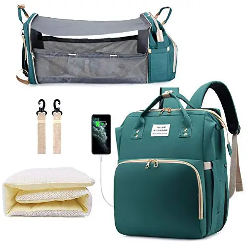A teal backpack diaper bag featuring a built-in changing pad and storage pockets.