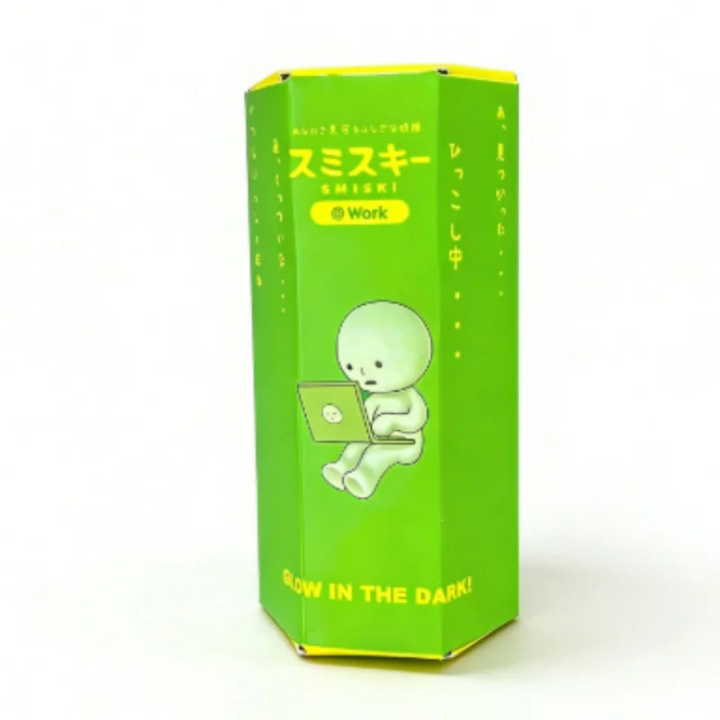 A green box for a SMISKI Work glow-in-the-dark collectible featuring a white, blob-like figure.