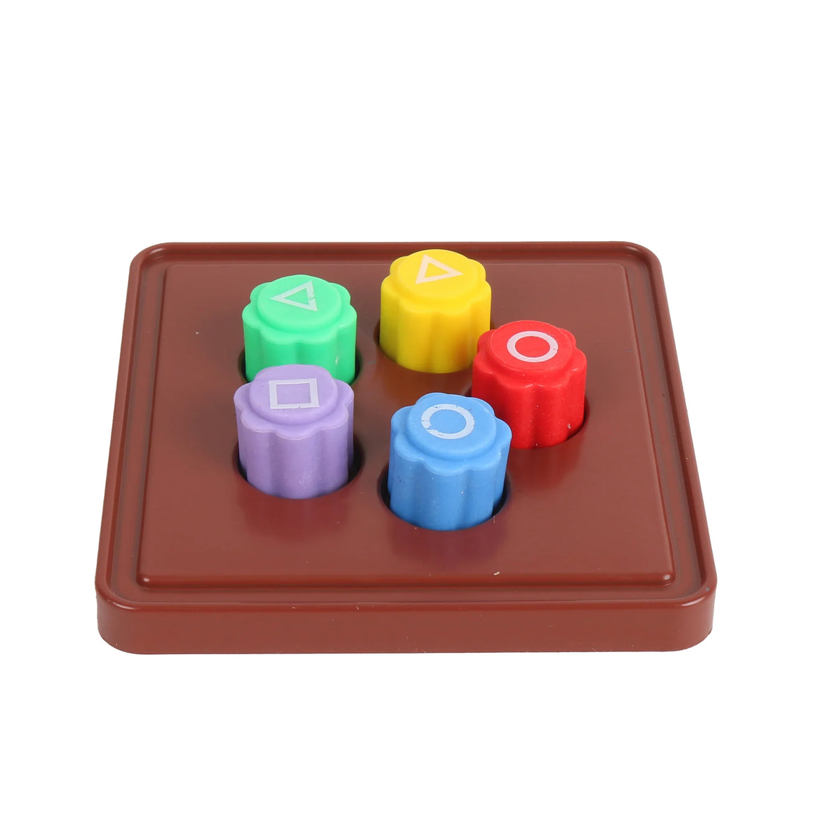 A set of five colored stones, including green, yellow, red, purple, and blue, arranged on a brown tray for a traditional Kore