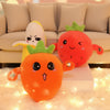 An orange and yellow plush toy shaped like a fruit, sitting on a white block in front of a sofa.