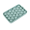 A silicone mold tray with multiple depressions shaped like grape clusters for soap and candle making.