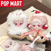 A collection of Skullpanda You Found Me! series collectible figures in a cardboard box with pink ribbon and white fluff.