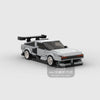 A gray and black classic supercar model built from building blocks.