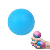 A hand is squeezing a large, bright blue water bead stress ball.