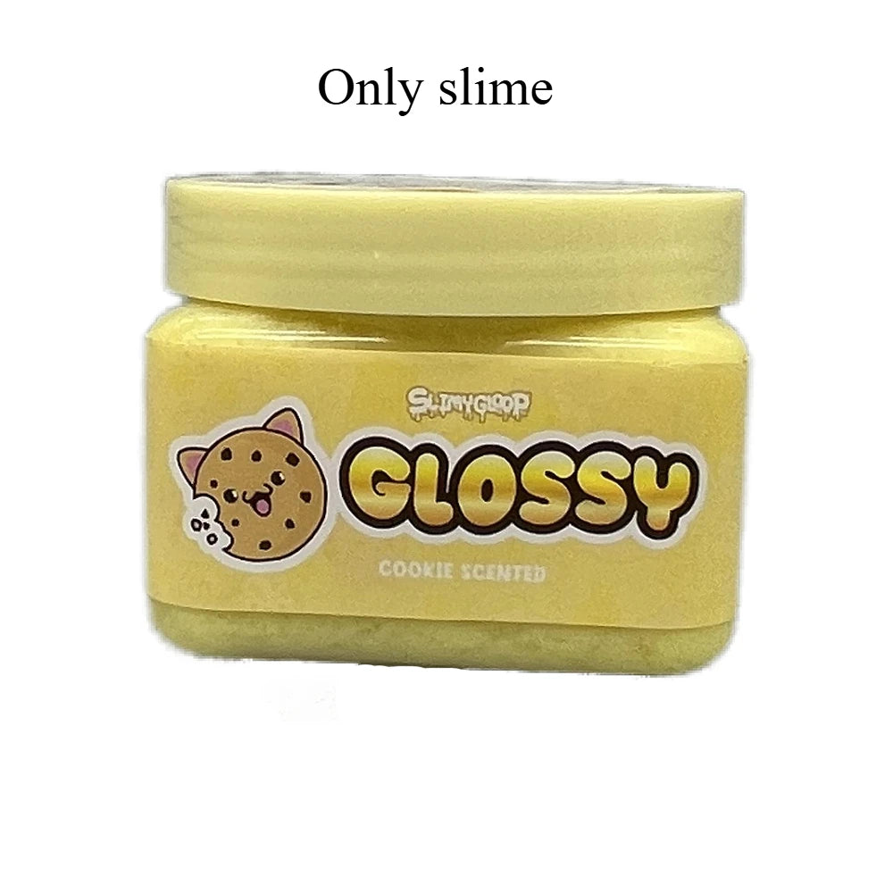 A clear plastic jar of yellow glossy slime labeled Cookie Scented by SlimeDrop
