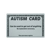 A gray card titled AUTISM CARD with text stating it can be used to get out of anything and never expires