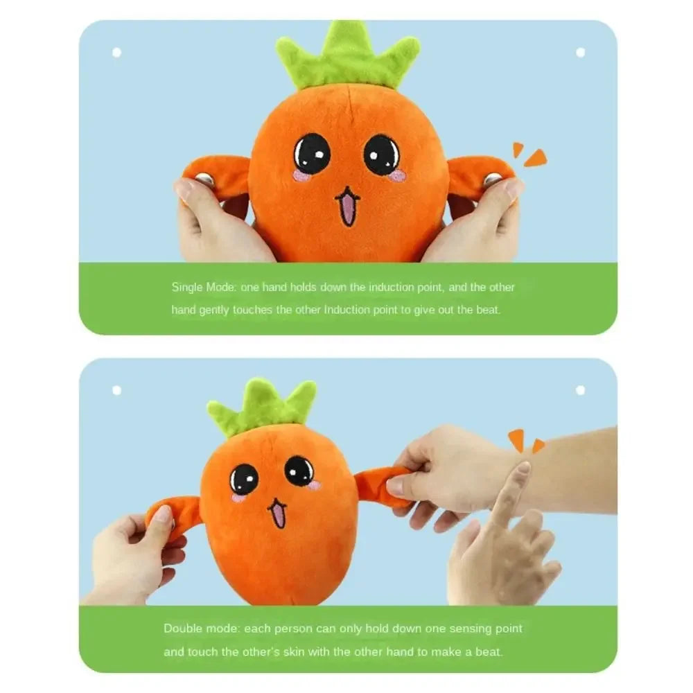 An orange fruit plush toy used for a beat-sensing musical interaction where one hand holds down a point and the other touches