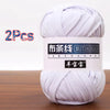 A skein of white soft chunky t-shirt yarn for crochet and knitting, packaged as a 2-pack.