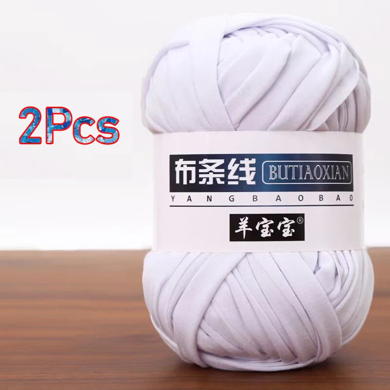 A skein of white soft chunky t-shirt yarn for crochet and knitting, packaged as a 2-pack.
