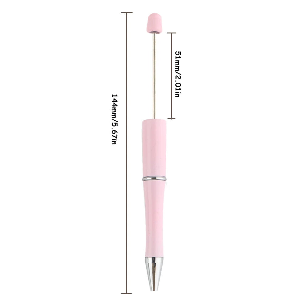 A pink beadable ballpoint pen with a silver tip and black ink, shown against a white background.