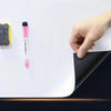 A hand is holding a pink dry erase marker next to a white magnetic board.