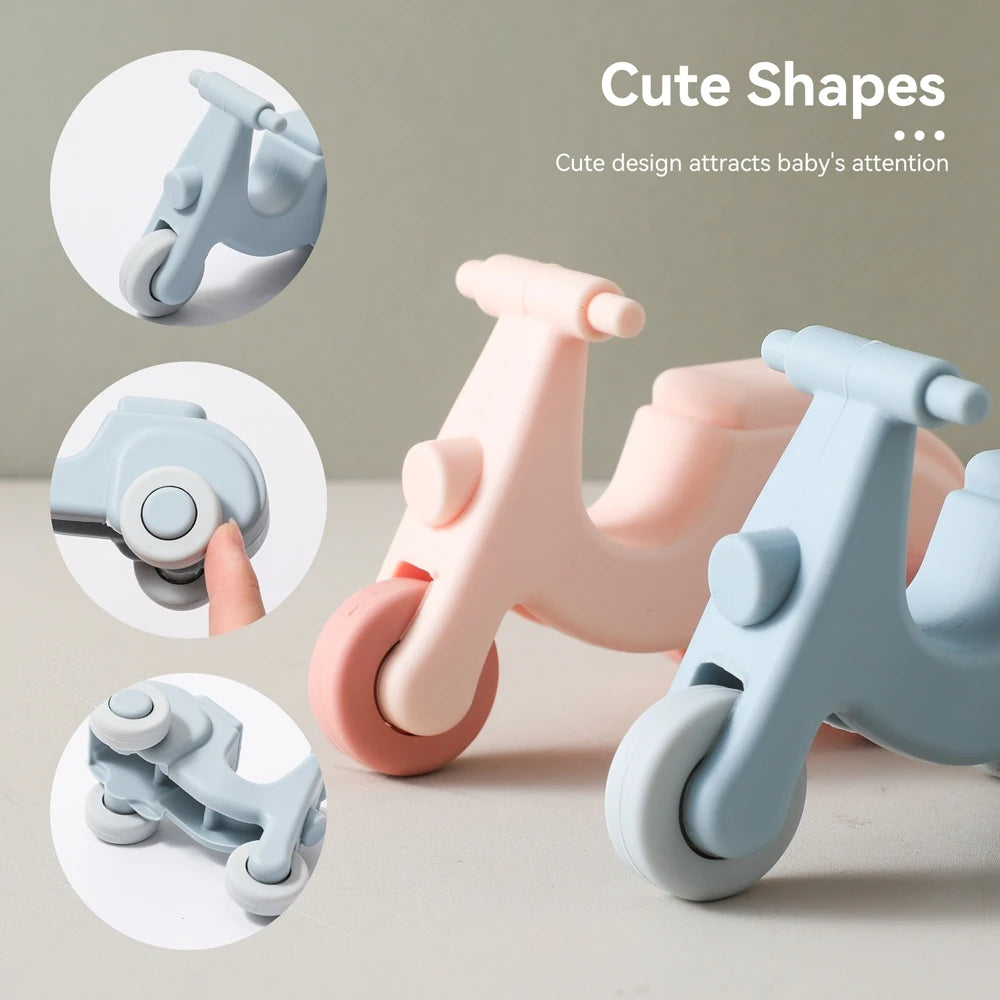 A set of cute silicone toy cars in pink and blue colors designed to attract a baby's attention.