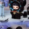 A dark black plush doll with a star-shaped cutout and light skin, displayed against a blue background.