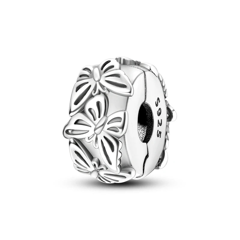 A sterling silver charm bead shaped like a flower or butterfly, used for DIY bracelet making.