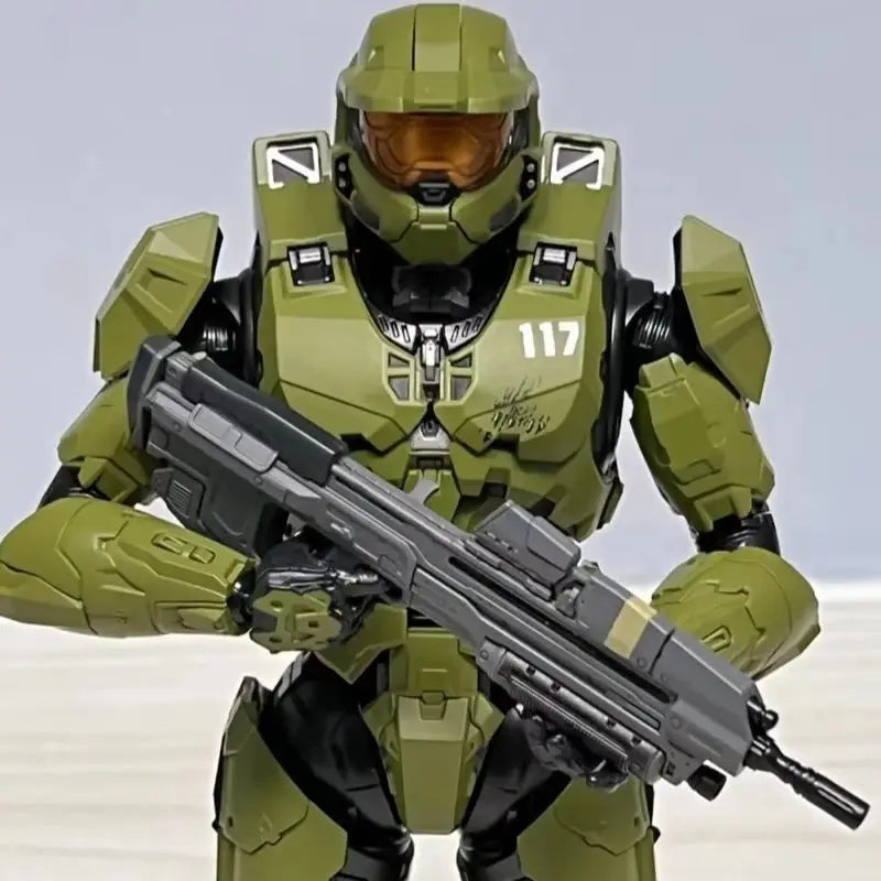 A 1/12 scale Master Chief action figure in olive green armor and helmet, holding an assault rifle.