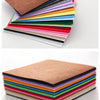A stack of colorful non-woven felt fabric sheets in various shades of pink, red, green, yellow, and blue.