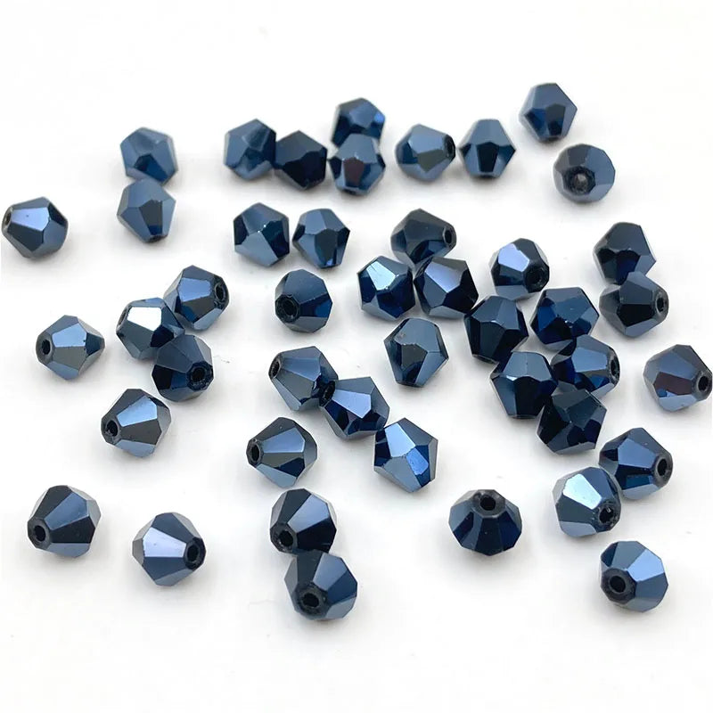 A collection of faceted blue crystal glass beads in various sizes and shapes for jewelry making
