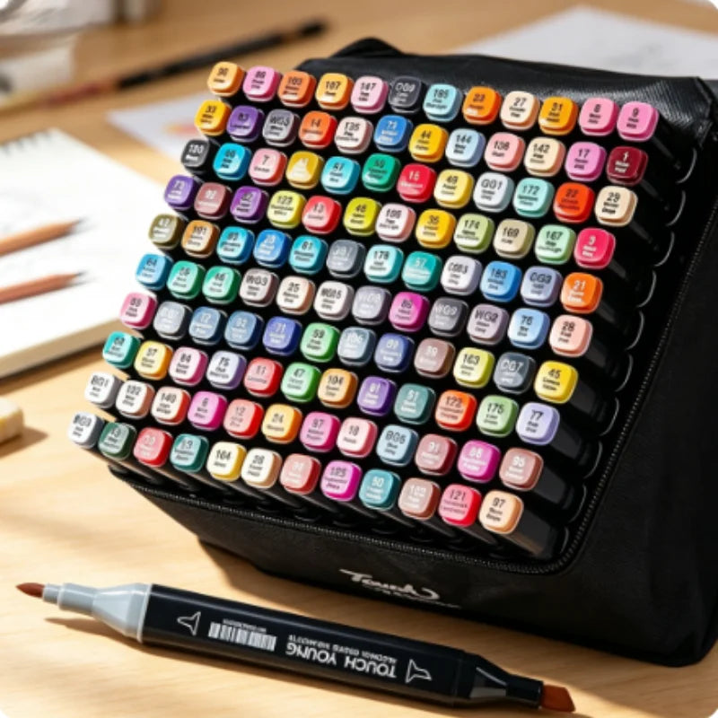 A collection of colorful dual-tip alcohol art markers arranged in a black case on a wooden surface.