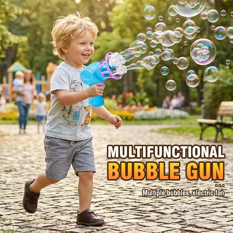 A young boy is playing with a blue bubble gun that shoots bubbles into the air in a park setting.