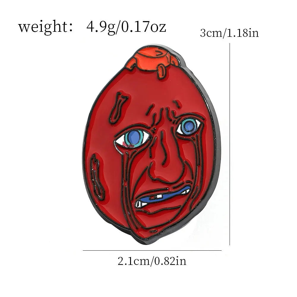 A red enamel lapel pin depicting a stylized, angry face with blue eyes and an open mouth.
