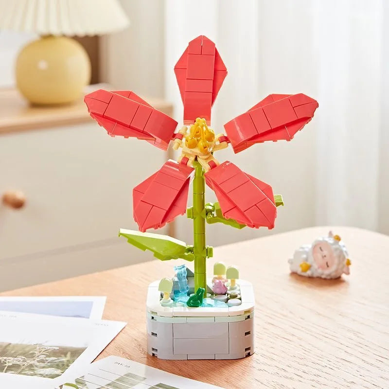 A set of red rose flower building blocks with green stems and white base.