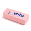 A pink rectangular butter stick labeled 40 oz net wt 113 g and salted butter.