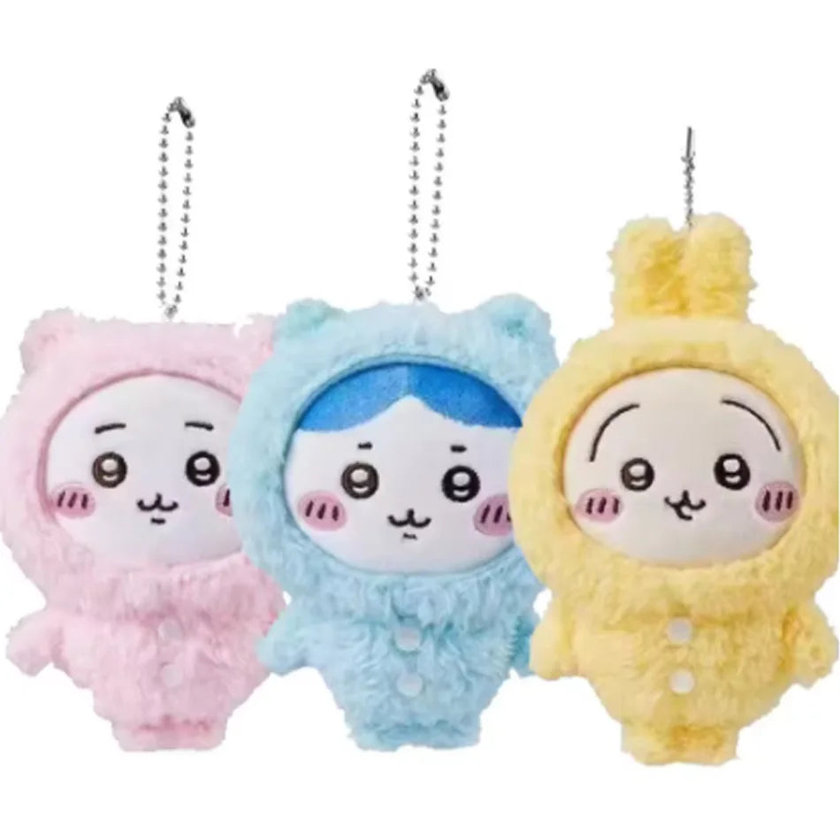 Three plush keychains of Usagi Hachiware characters in pink blue and yellow with a pajama theme