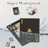 A set of black frosted poker playing cards with gold accents shown near water droplets.