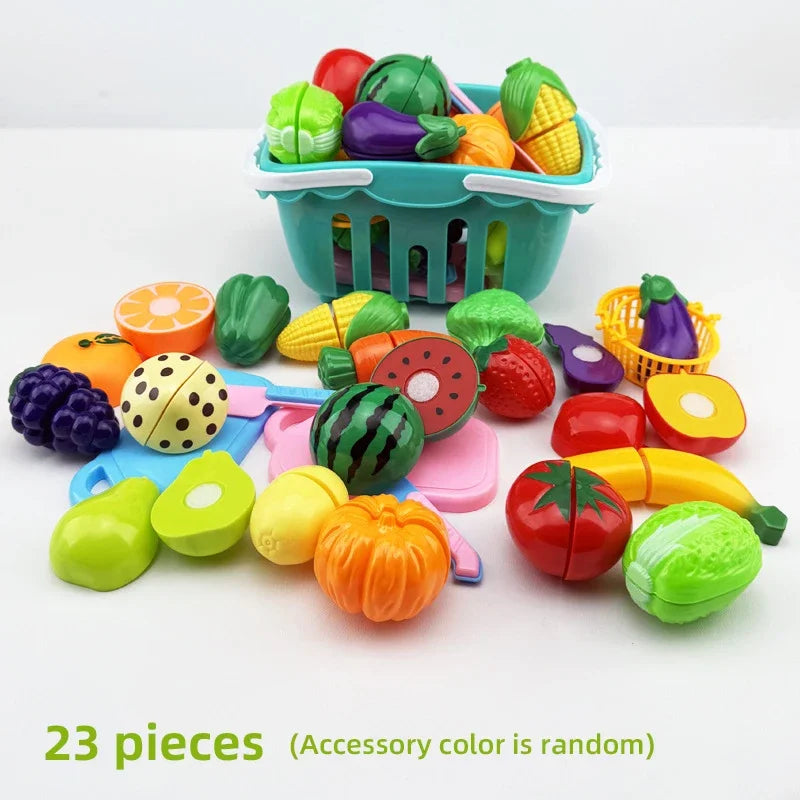 A set of 23 pretend play cutting food toys, including various fruits and vegetables, stored in a green shopping basket.