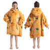 A child models an orange-patterned, fuzzy yellow hoodie sweater for winter.