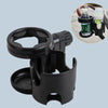 Schwarze 2-in-1 Kinderwagen-Tasse und Handyhalter mit Silikonflasche und klarem Becher sichtbar.