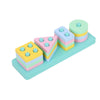 A set of colorful wooden sorting toys featuring various shapes and colors stacked on a light blue surface.