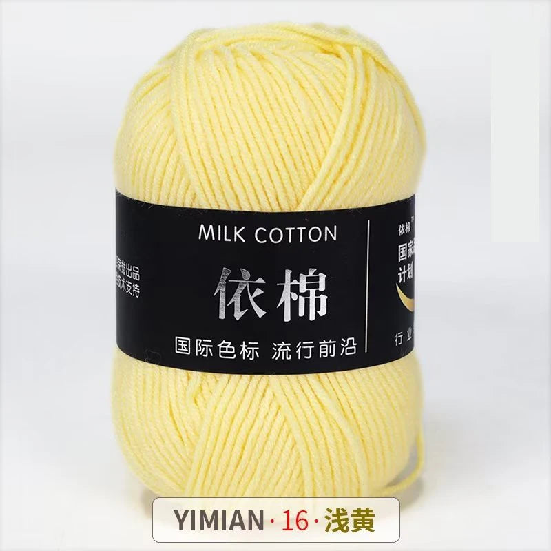 A ball of yellow milk cotton yarn labeled YIMIAN 16, ready for knitting or crochet.
