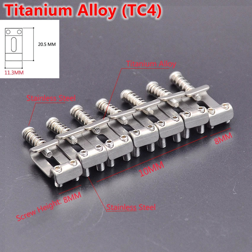 A set of titanium alloy guitar bridge saddles and mounting hardware for electric guitars.