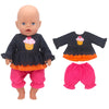 A baby doll outfit set featuring a dark blue top with a cupcake design and bright pink pants.