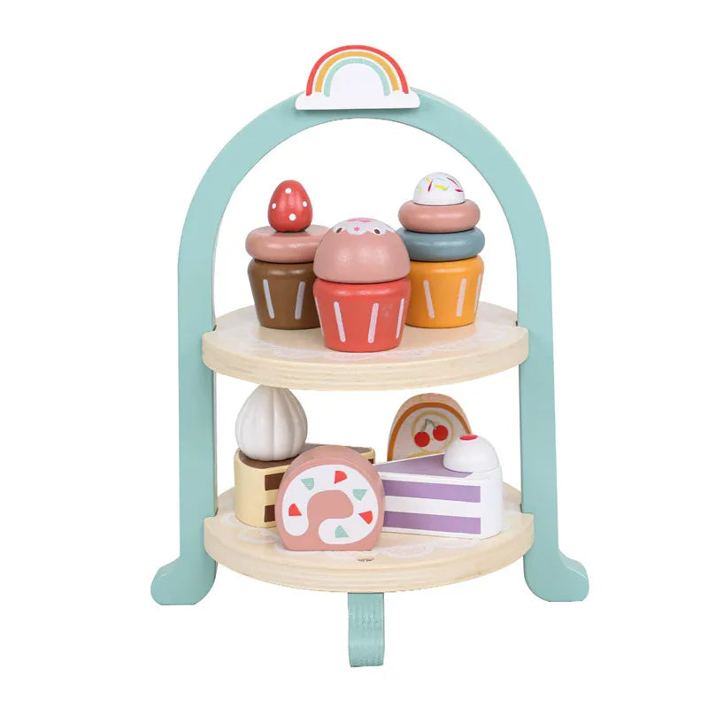 A wooden pretend play kitchen set featuring a rainbow arch and various food-themed accessories like coffee makers and tea cup