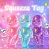 Three squishy baby toys in pink, blue, and purple glitter are displayed against a soft light background.