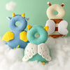 Three soft fabric head protectors shaped like animals in blue, yellow, and green floating on white clouds.
