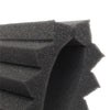 Close-up view of black acoustic foam panels with textured, irregular shapes.