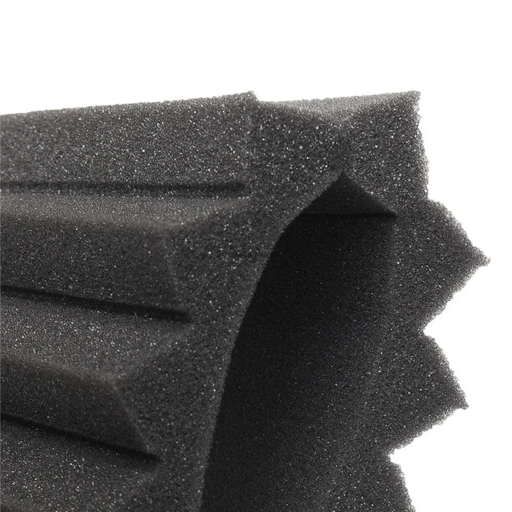 Close-up view of black acoustic foam panels with textured, irregular shapes.